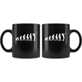 The theory of evolution trombone black coffee mug