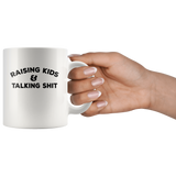 Raising kids and talking shit white coffee mug