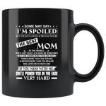 Some May Say I Am Spoiled But I Am Just Loved & Protected By The Best Mom Mess Me Punch Face Mothers Day Gifts Black Coffee Mug