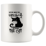 Never mind the witch beware the cat white coffee mug