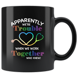 Apparently we're trouble when we work together who new nurse black coffee mug