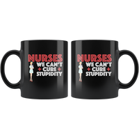 Nurses we can't cure stupidity black coffee mug