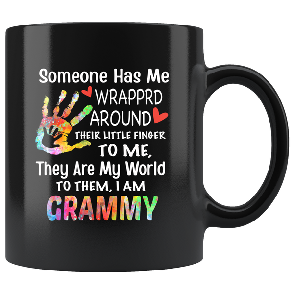 Someone has wrapped around their little finger to me they are my world, to them i am grammy black coffee mug