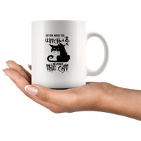 Never mind the witch beware the cat white coffee mug