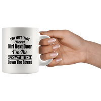 I'm not the sweet girl next door I'm the crazy bitch down the street white gift coffee mug