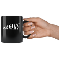 The theory of evolution trombone black coffee mug