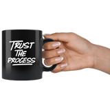 Trust the process black coffee mugs