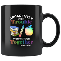 Apparently we're trouble when we teach together who knew girl black coffee mug