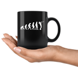 The theory of evolution trombone black coffee mug