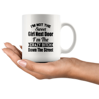 I'm not the sweet girl next door I'm the crazy bitch down the street white gift coffee mug