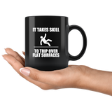 It takes skill to trip over flat surfaces black coffee mug