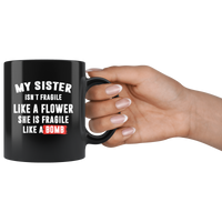 My sister isn't fragile like a flower she is fragile like a bomb black coffee mug
