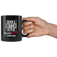 Being a bitch helps me tolerate your stupid face black coffee mug