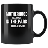 Motherhood is a walk in the jurassic park mother black coffee mug