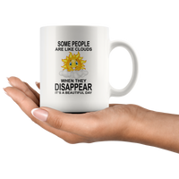 Some people are like clouds when they disappear it's a beautiful day funny sun white coffee mug