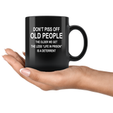 Don't piss off old people the older we get the less life in prison is a deterrent black coffee mug