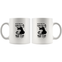 Never mind the witch beware the cat white coffee mug